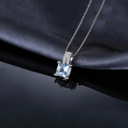 Dije y Cadena Con Topacio Azul En plata 925